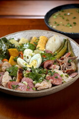 Poached turkey, a classic dish of Bahian cuisine with turkey meat, vegetables, bananas, eggs and sausage