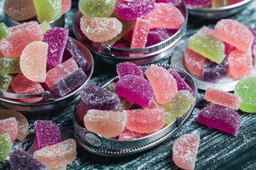 Dessert marmalade in the form of lemon and orange slices. The sweetness of jelly candy.