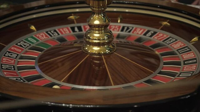 The rotating roulette wheel in the casino