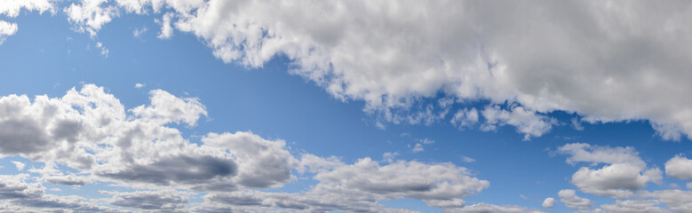 Naklejka na ściany i meble panorama with many large clouds in day sky