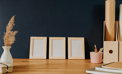 Set of three frames on office desk