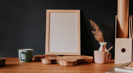 Vertical empty frame stanting on wooden slice