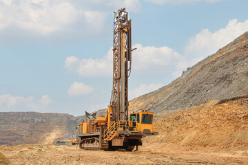 Machine for drilling wells in the quarry. Drilling of boreholes for laying an explosion in a...