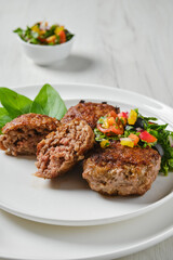 Closeup view of fried frozen veal meatballs on a plate