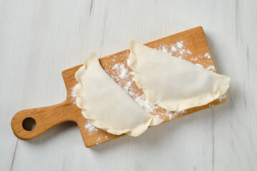Top view of cheburek - a pie made of thin unleavened dough stuffed with lamb and hot spices