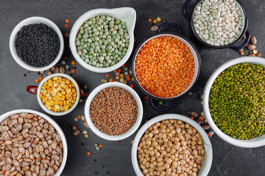 Many bowls of various legumes.Top view