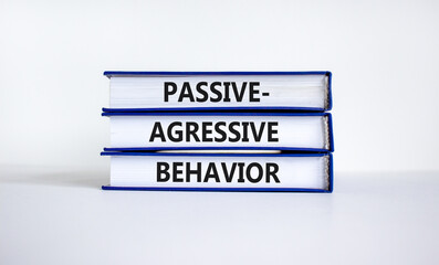 Passive-aggressive behavior symbol. Concept words Passive-aggressive behavior on books. Beautiful...