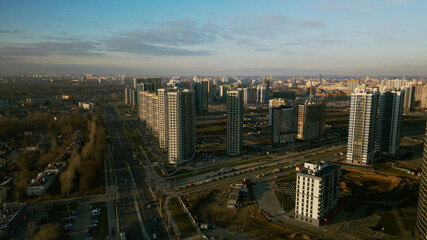 Obraz premium Construction site. Construction of modern multi-storey buildings. Against the background of the blue sky. Aerial photography.