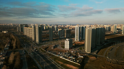 Obraz premium Construction site. Construction of modern multi-storey buildings. Against the background of the blue sky. Aerial photography.