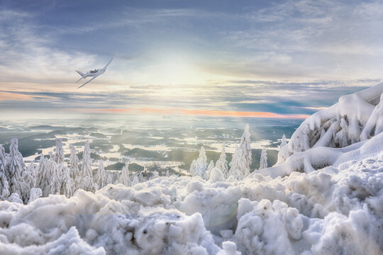 beautiful winter view of the valley from Je&scaron;těd and sunset with a plane