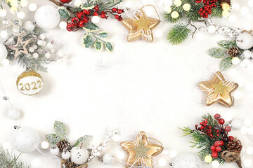 Christmas and new year frame made of decorations, fir branches and cones, winter composition with place for text, advertising banner for store and screen, mockup for design,