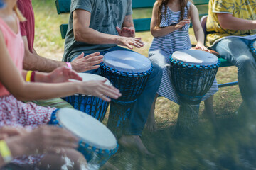 djembe lesson, people learn to play the drum - Powered by Adobe