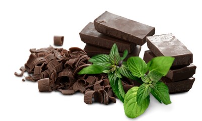 Milk chocolate and mint leaves on the desk