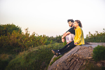 Young heterosexual couple kissing at the park