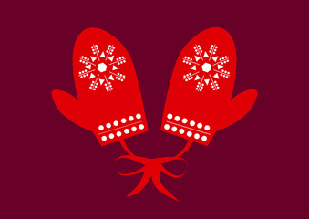 Winter red mittens with a Christmas pattern of white snowflakes and circles.