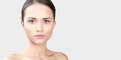 Fototapeta premium Portrait of a young woman with natural makeup. Advertising for a beauty salon