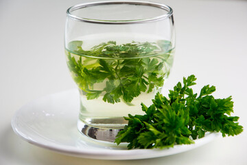 napar, ziołaowa herbata z natki pietruszki, infusion with parsley, herbal tea with parsley  - obrazy, fototapety, plakaty