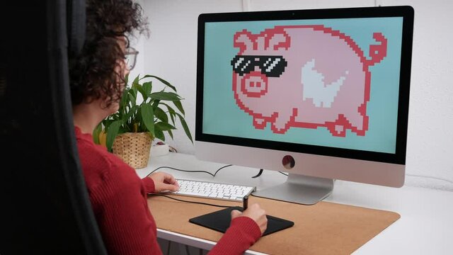 Unrecognizable woman illustrator painting NFT on computer