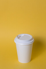 white coffee glass isolated on yellow background