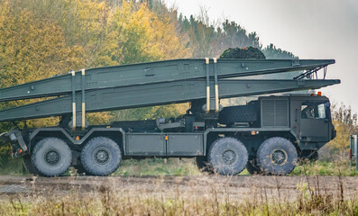 Fototapeta premium British army Alvis unipower 8x8 tank bridge transporter in action on a military exercise, Salisbury Plain, UK