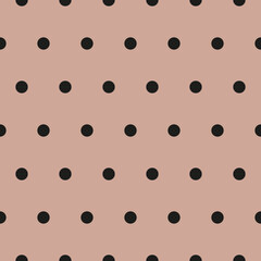 Light pink background black polka seamless pattern. Fabric designs and backgrounds.