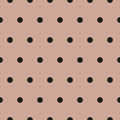 Light pink background black polka seamless pattern. Fabric designs and backgrounds.
