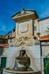 Fountain with monument in the old town of Grimaud - France, Departement Var, Côte d‘Azur