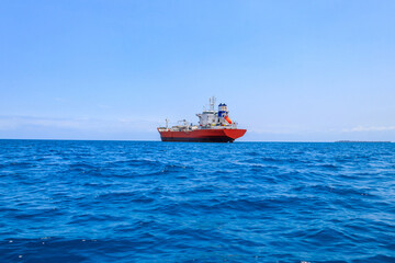 Fototapeta premium Large industrial ship sailing in the Indian ocean near Zanzibar, Tanzania