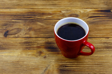 Cup of coffee on the wooden table