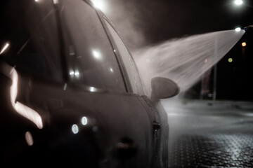 night car wash - cleaning the car in the evening