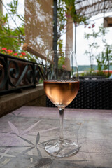 Summer on French Riviera Cote d'Azur, drinking cold rose  wine from Cotes de Provence on outdoor terrase in cafe