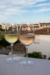 Summer on French Riviera Cote d'Azur, drinking cold rose and white wine from Cotes de Provence on outdoor terrase in Port Grimaud, Var, France