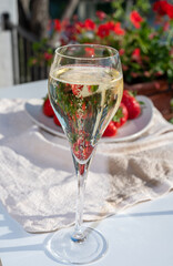 Summer party, pouring of French champagne sparkling wine in glasses in yacht harbour of Port Grimaud near Saint-Tropez, French Riviera vacation, France