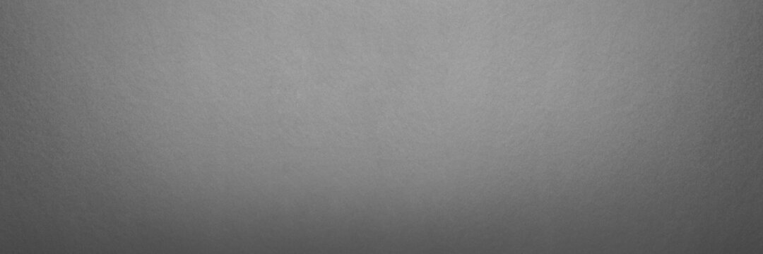 Gray textured paper background. Panorama texture gray cardboard seamless pattern. Large format photo for print or banner. For your project or design.