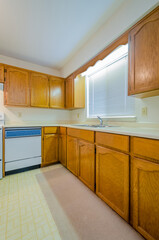 An empty kitchen in a house.