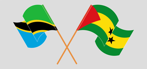 Crossed and waving flags of Tanzania and Sao Tome and Principe