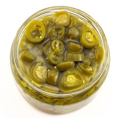 Top view of sliced of pickled green jalapeno peppers in a glass bowl isolated on white background.
