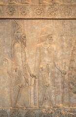 A relief in Persepolis shows two figures in profile, a striking example of the refined stone carving from ancient Persia