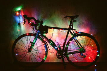 Fototapeta na wymiar Bicycle decorated with Christmas lights