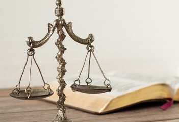 Law and justice Christian biblical concept. Old ancient vintage weighing scale balance with open...