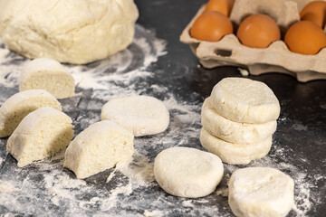 Cottage cheese pancakes in raw. Cooking curd fritters at home, rolling dough, easy recipe