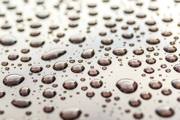 Pattern of water drops in a shining metallic surface with sky reflections,Water droplet on the car hood. Realistic pure water droplet water drops for creative banner design