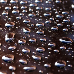 Pattern of water drops in a shining metallic surface with sky reflections,Water droplet on the car hood. Realistic pure water droplet water drops for creative banner design