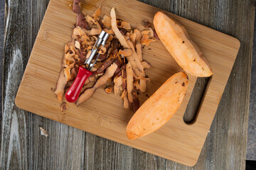 Peeled Sweet Potato on a Cutting Board 