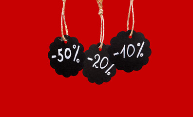 Sale and discount concept. Black tags with the inscription minus 10, 20 and 50 percent on a red...
