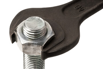 Big black wrench tightening a silver nut on the bolt macro isolated on white
