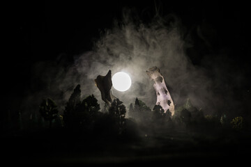Animal bone in dark Halloween night with fog and light on background / Selective focus and space for text. Abstract horror concept