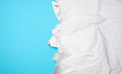 crumpled white paper with torn edges
