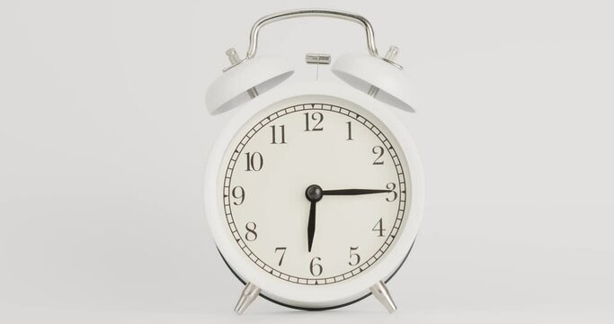 Alarm clock isolated on a white background, Showtime 06.00 am or pm, Timelapse moving fast.