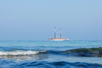 A cruise ship sailing on the sea. Travel by ferry. Sea cruise on a ship. Blue seascape with ship....